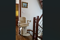 beige stair lift installed inside a house