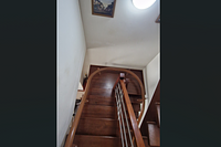 Stairlift railing installed along a staircase inside a house